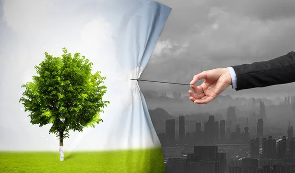 Hand pulling nature cityscape curtain to gray cityscape — Stock Photo, Image