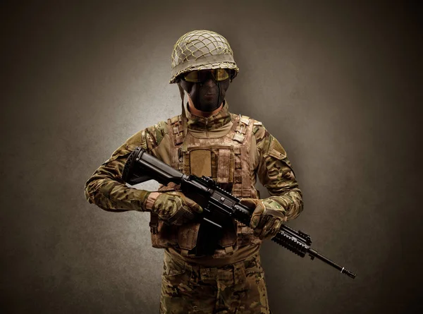 Soldier agent in a dark space with arms — Stock Photo, Image