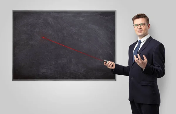 Handsome man teaching in classroom — Stock Photo, Image