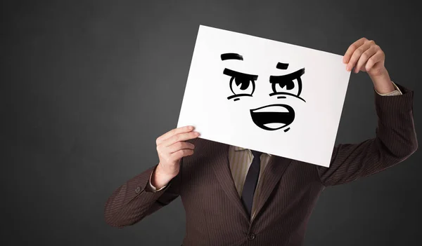 Houder van een papier met grappige emoticon voor haar gezicht — Stockfoto