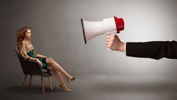 Elegant model sitting opposite with a big loudspeaker — Stock Photo, Image