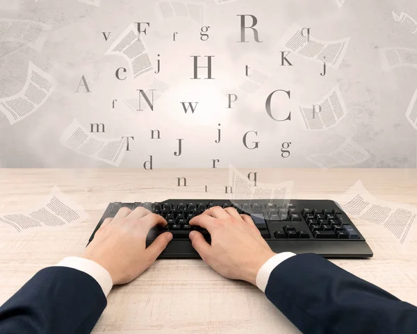 Elegant businessman hand typing with fluttering papers around