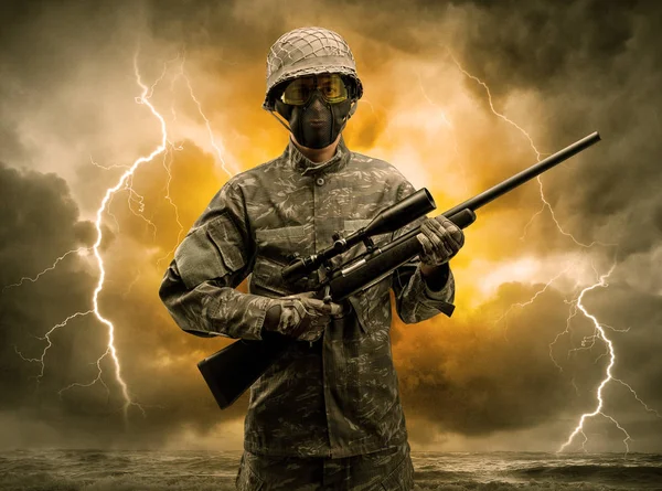 Armed soldier standing in an obscure weather — Stock Photo, Image