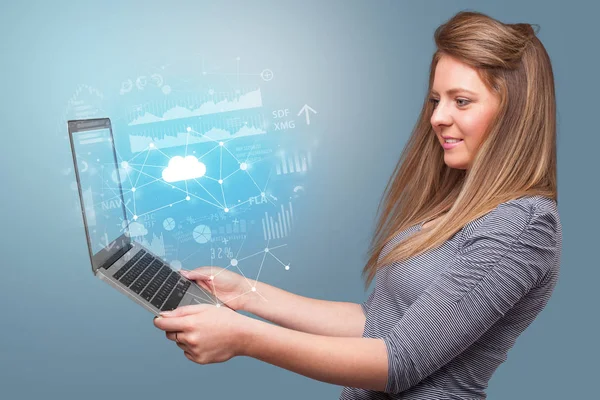 Woman holding laptop with cloud based system concept — Stock Photo, Image