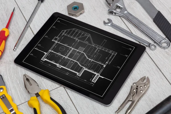 Tablet and tools with blueprint concept — Stock Photo, Image