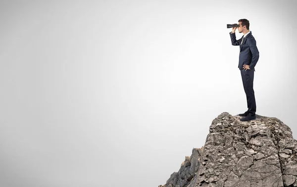 Business person on the top of the rock with copy space — Stock Photo, Image