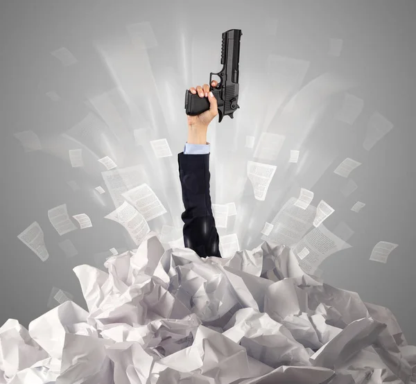 Hand coming out from paper pile — Stock Photo, Image