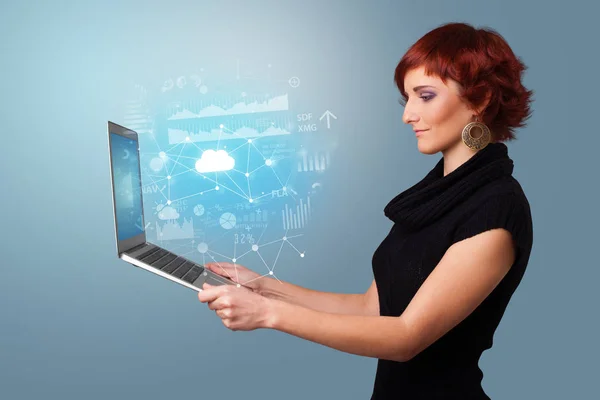 Woman holding laptop with cloud based system concept — Stock Photo, Image