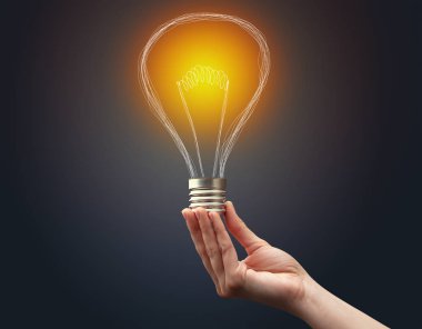 Koyu arkaplanda el ele tutuşan ampul