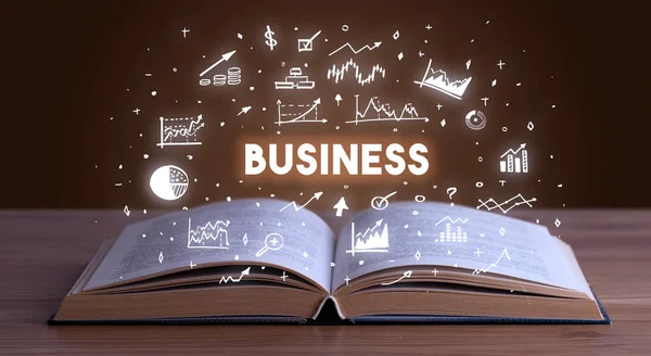 Business inscription coming out from an open book — Stock Photo, Image