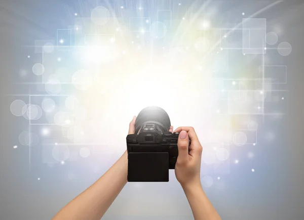 Hand taking photo with glowing flash concept — Stock Photo, Image