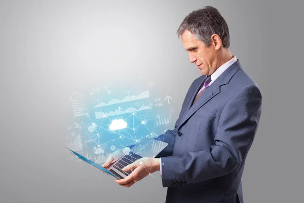 Man holding laptop with cloud based system concept — Stock Photo, Image