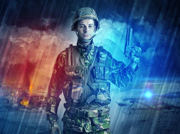 Armed soldier standing in the middle of dust storm — Stock Photo, Image