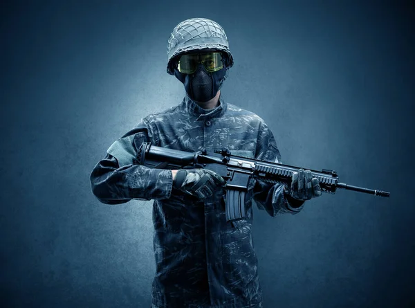 Soldier agent in a dark space with arms — Stock Photo, Image