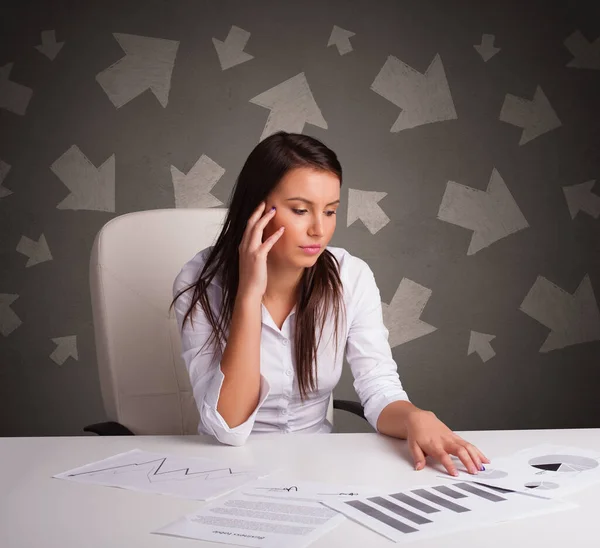 Manager in front of the office desk with direction concept — Stock Photo, Image