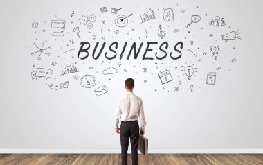 Yöneticisi iş kavramı ile bir duvara bakarak şüphe