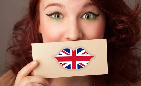 Person holding UK flag card