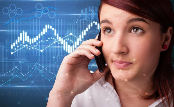 Person telefoniert mit Diagrammen im Hintergrund — Stockfoto