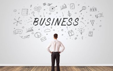 Yöneticisi iş kavramı ile bir duvara bakarak şüphe