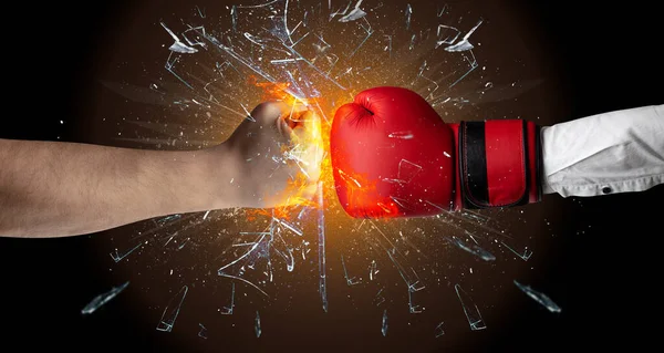 Fighting hands breaking glass — Stock Photo, Image