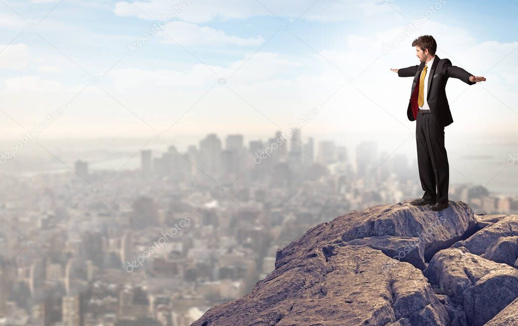 Business person looking to the city from distance