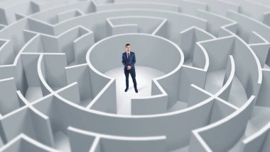 Businessman standing in a middle of a round maze clipart
