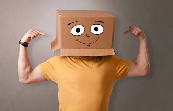 Young boy with happy cardboard box face — Stock Photo, Image