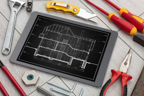 Tablet and tools with blueprint concept — Stock Photo, Image