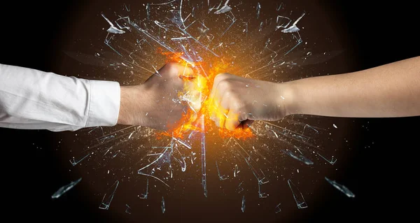 Fighting hands breaking glass — Stock Photo, Image