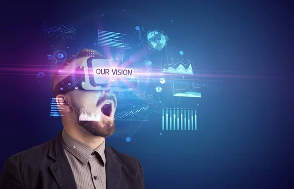 Businessman looking through Virtual Reality glasses — Stock Photo, Image