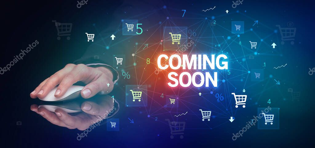 Hand holding wireless peripheral with COMING SOON inscription, online shopping concept