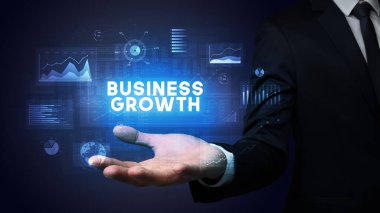 Motivasyon mesajı taşıyan iş adamının eli