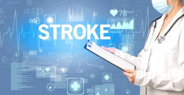 Genç doktor notlar yazıyor.