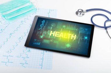 Tablet bilgisayar ve tıbbi malzemeler.