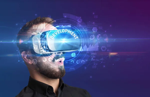 Businessman looking through VR glasses — Stock Photo, Image