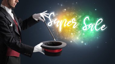 Genç sihirbaz sihir numarası yapıyor.