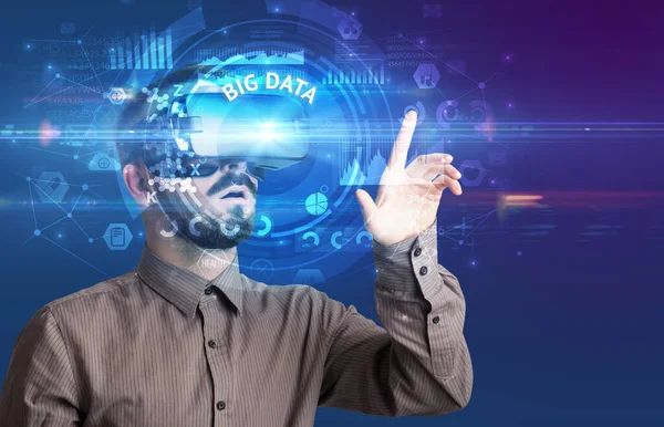 Businessman looking through VR glasses — Stock Photo, Image