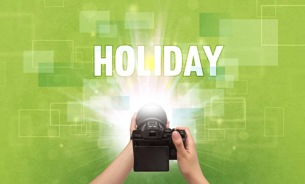 Hand holding digital camera, traveling concept — Stock Photo, Image