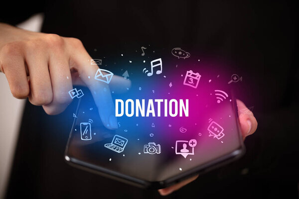 Businessman holding a foldable smartphone, social media concept