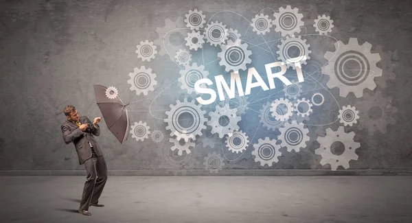 Şemsiyeyle savunma yapan iş adamı