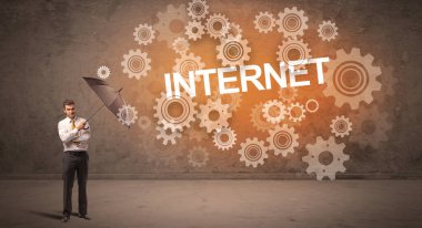 Şemsiyeyle savunma yapan iş adamı