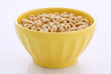 Lezzetli ve besleyici hafifçe tost bal fındık Mısır gevreği vintage stil üzerinde döngüler