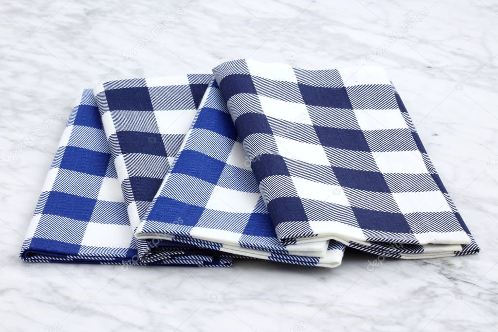 set of fabric napkins on marble countertop
