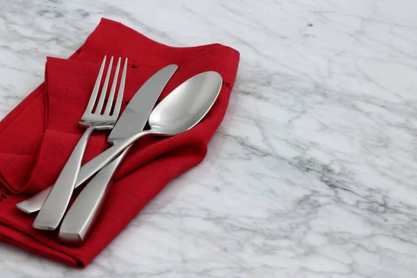 Beautiful silverware on fine napkin — Stock Photo, Image