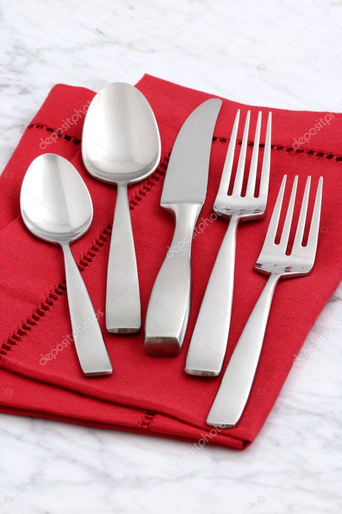 beautiful silverware on fine napkin