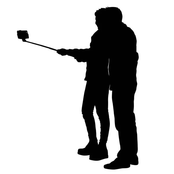 Silhuetas homem e mulher tomando selfie com smartphone no fundo branco —  Vetores de Stock