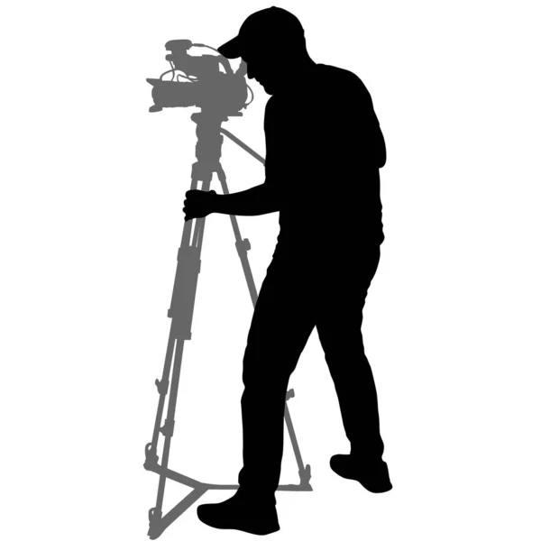 Cameraman con videocamera. Silhouette su sfondo bianco — Vettoriale Stock