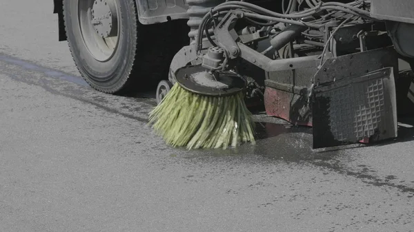 Watering machine going down the Old Arbat Street — Stock Photo, Image