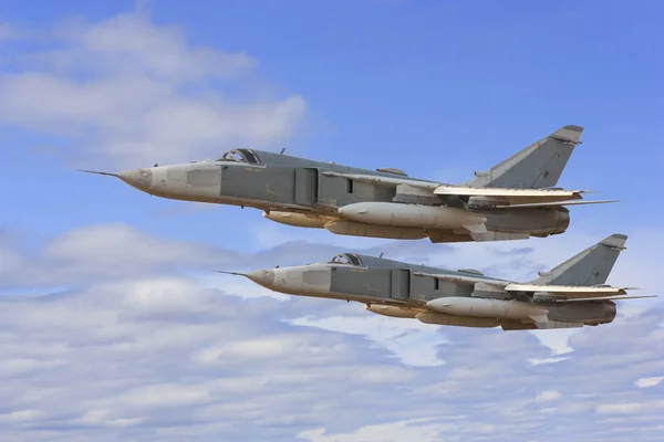 Military jet bomber Su-24 Fencer flying above the clouds — Stock Photo, Image