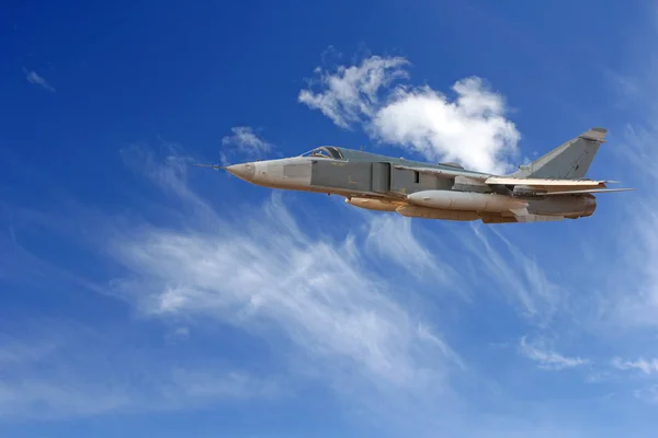 Military jet bomber Su-24 Fencer flying above the clouds — Stock Photo, Image